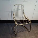 Chaise métallique tubulaire recouverte de dorure