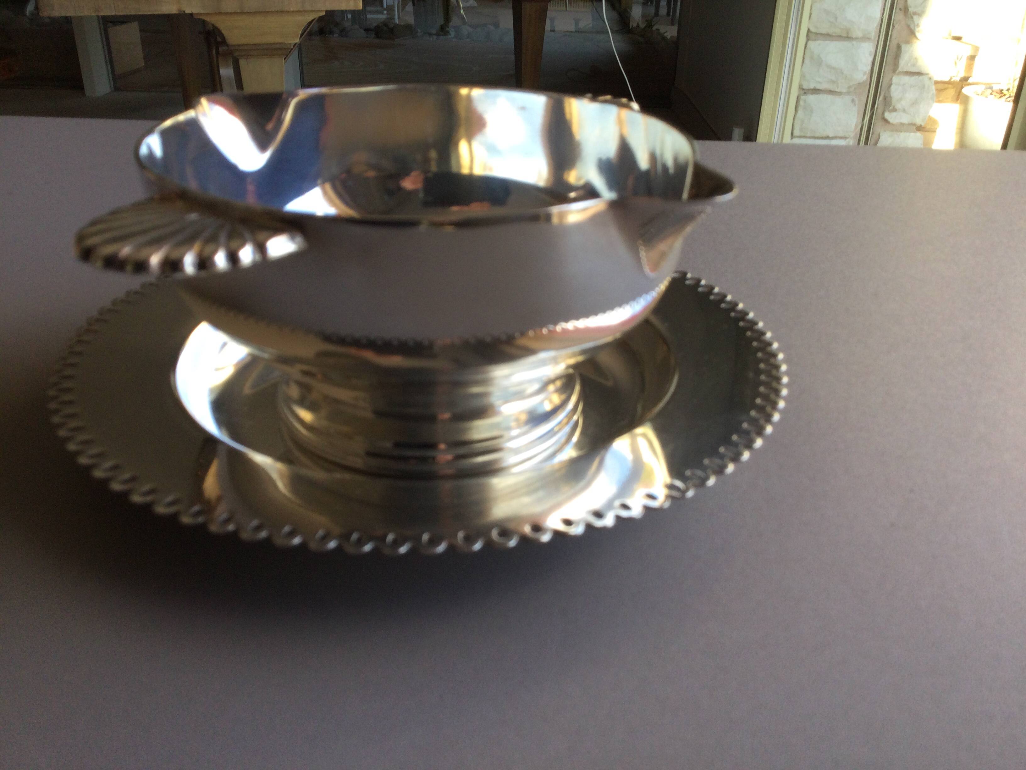 silver-plated metal sauce boat