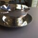silver-plated metal sauce boat