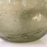 Old demijohn full of bubbles