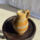 Vintage yellow stoneware carafe with beaded friezes Made in France H22
