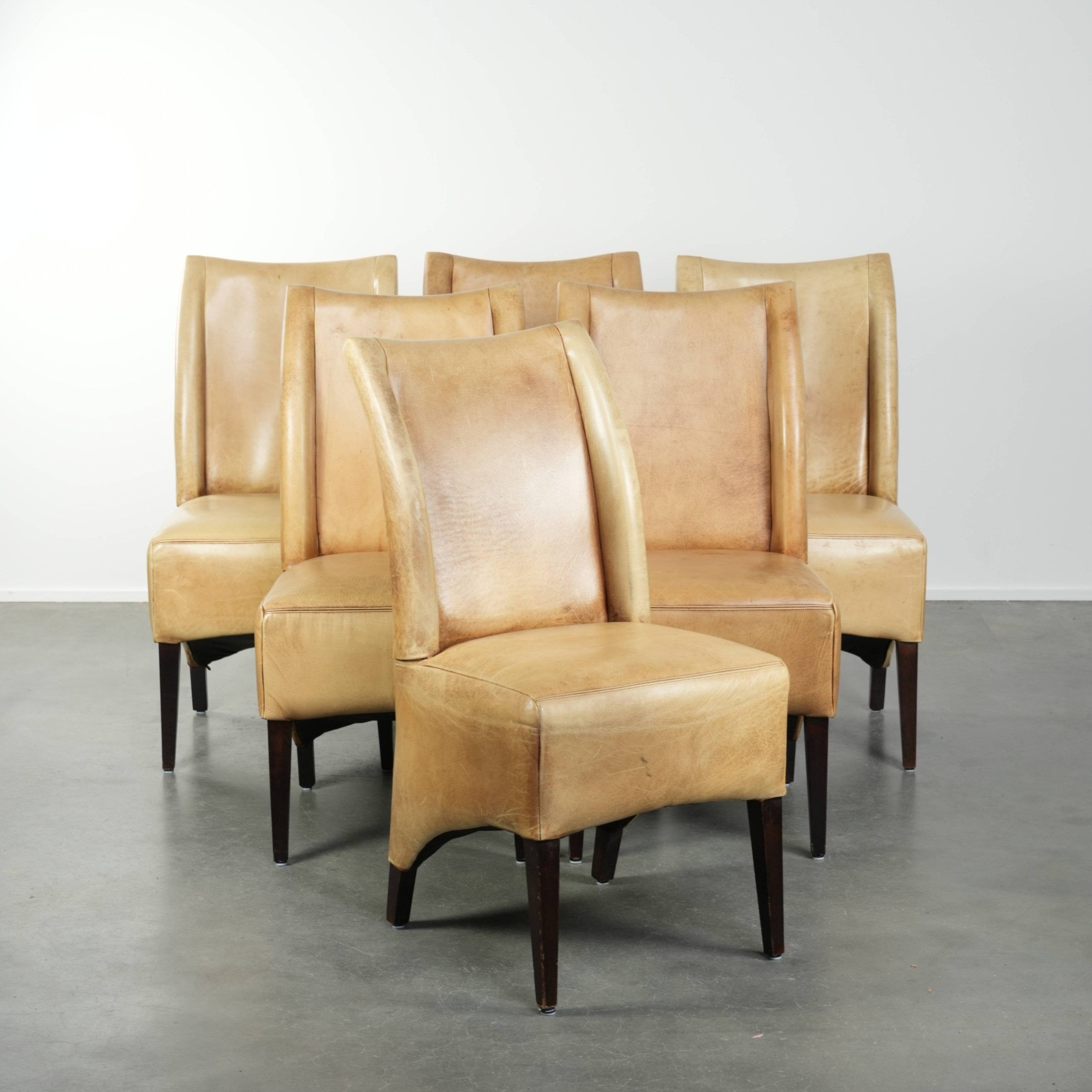 Set of six cowhide dining chairs with a comfortable seat and high back