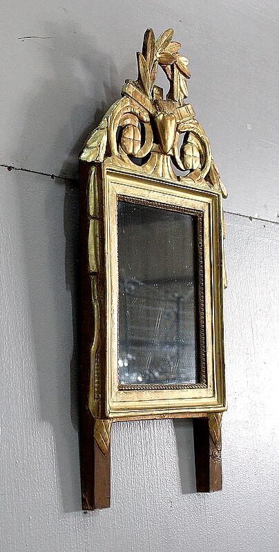 Miroir en bois doré, style Louis XVl, début XXe