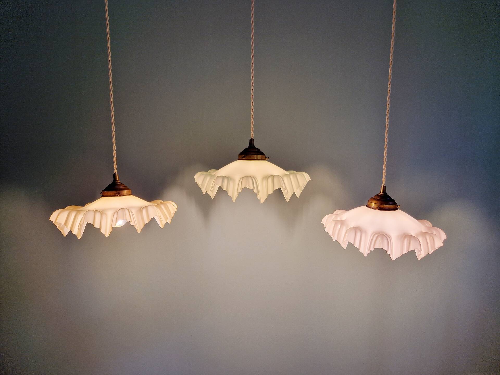 Art Deco trio of suspensions in coloured frilled opaline, 1920-30.