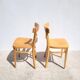 Pair of bistro chairs in light beech.