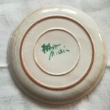 Round dish with thistles