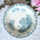 Mismatched antique flat plates made of ironstone accompanied by
