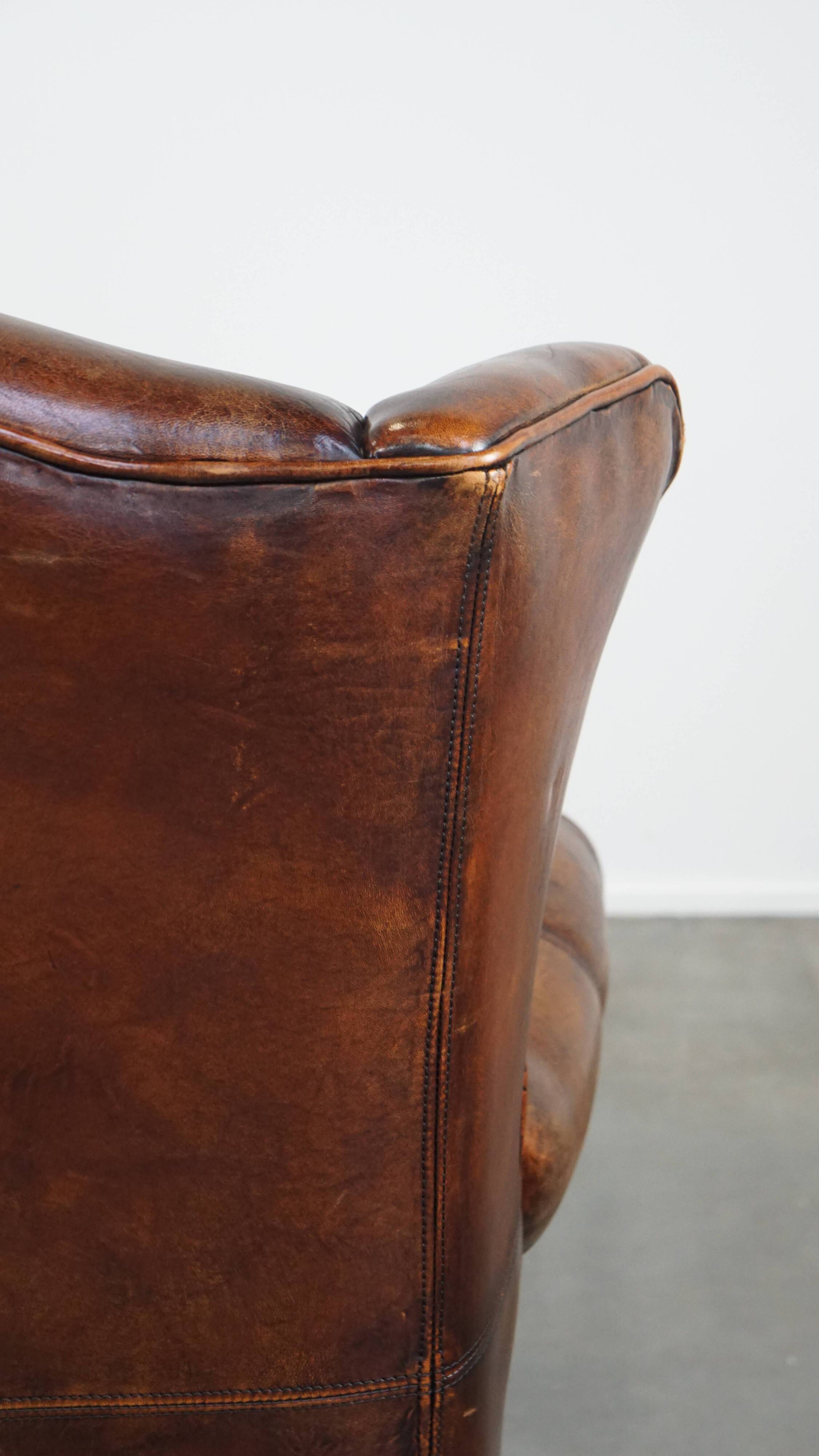 Fauteuil à oreilles en cuir de mouton