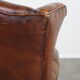 Fauteuil à oreilles en cuir de mouton