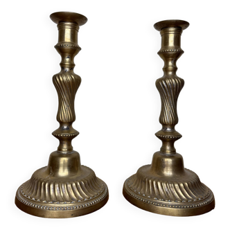 pair of Louis XV period candlesticks in gilded bronze