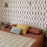 Set of 2 vintage woven rattan bedside tables.