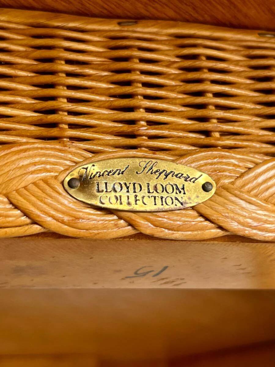 Natural Lloyd Loom paper cord rattan round table with brass-capped legs by Vincent Sheppard