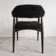 Pair of Mid Century Modern armchairs in astrakhan leather.