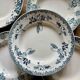 Set of 8 mismatched antique ironstone deep plates.