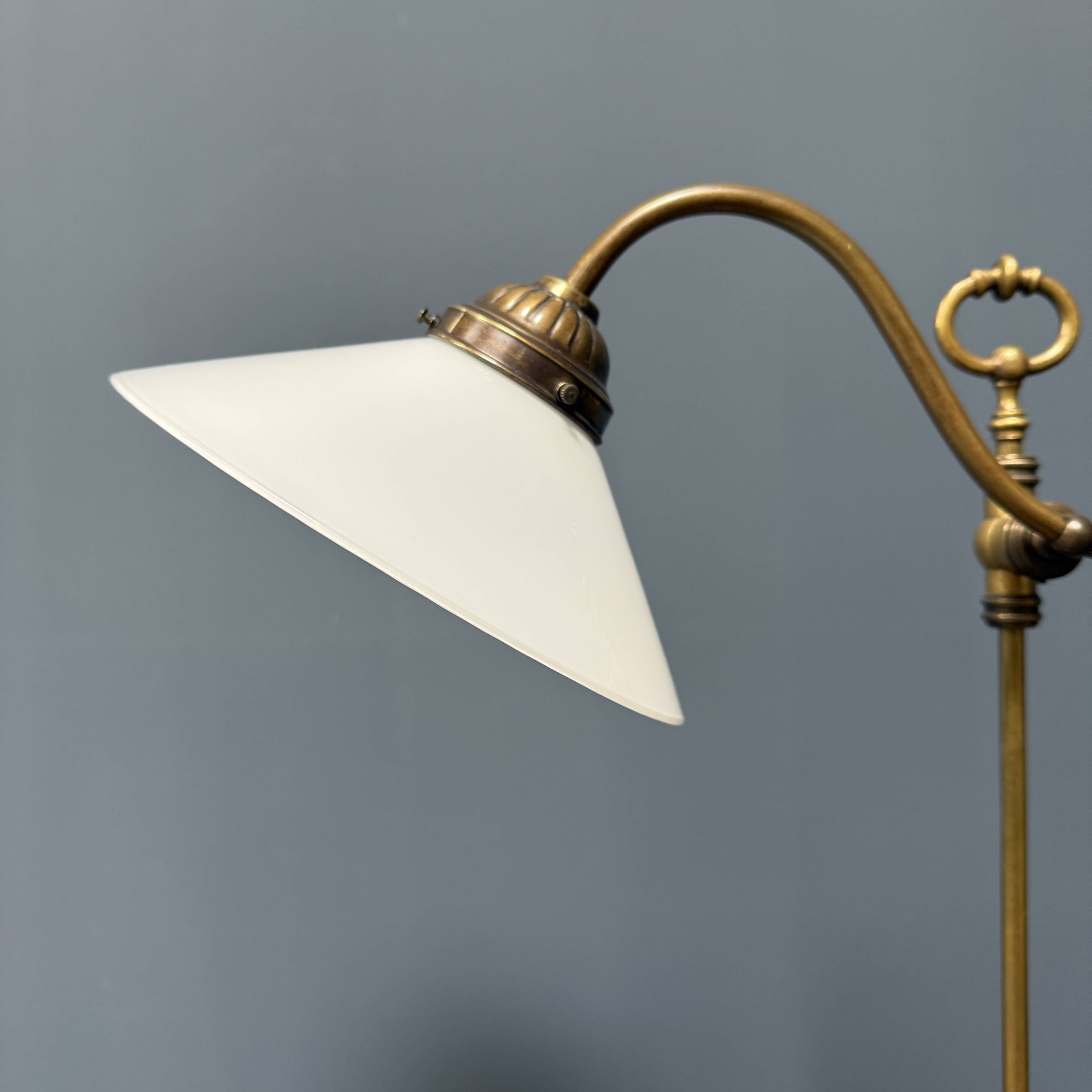 Adjustable brass table lamp with opaline glass shade