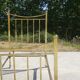 Antique gold-plated brass bed for one person.