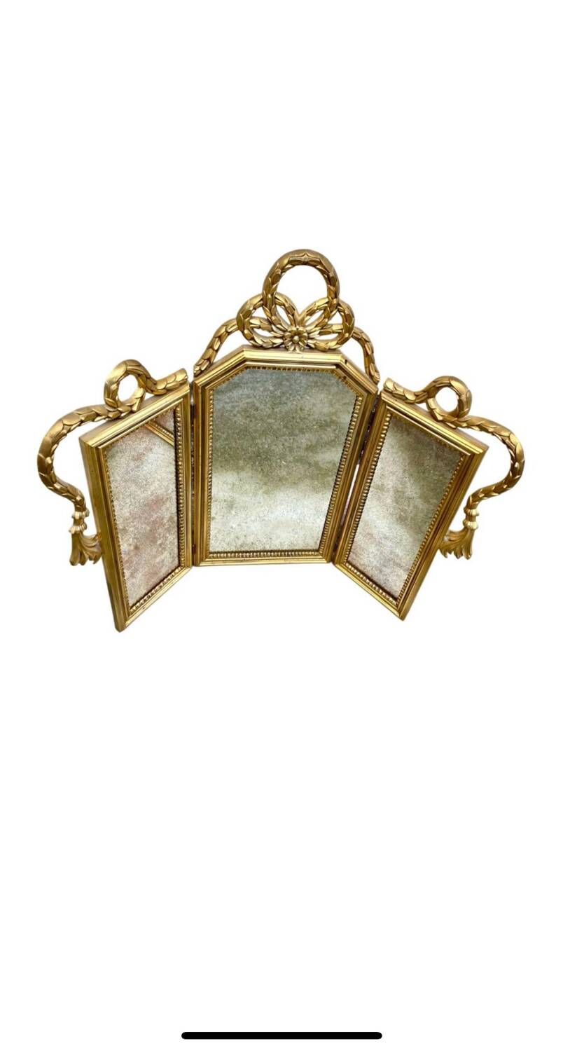 Miroir triptyque en bois doré et sculpté