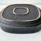 Large decorative ceramic catchall with red and black spiral pattern.