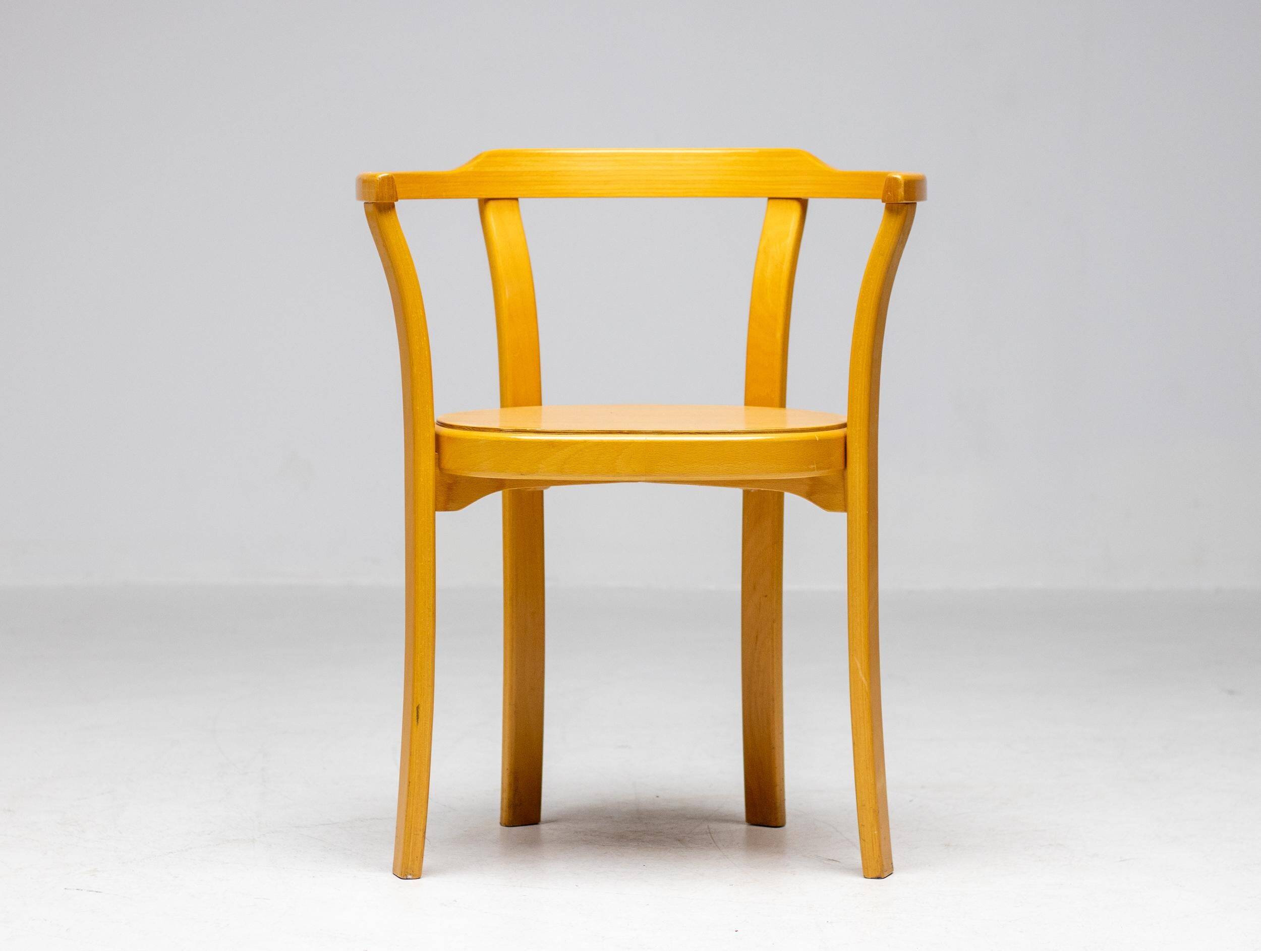 Stackable chairs in curved beech.