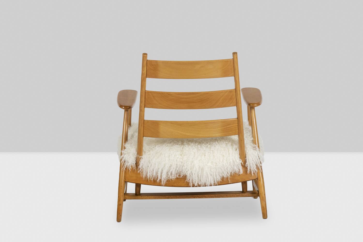 Pair of “lounge” armchairs in blond beech. 1950s