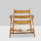 Pair of “lounge” armchairs in blond beech. 1950s
