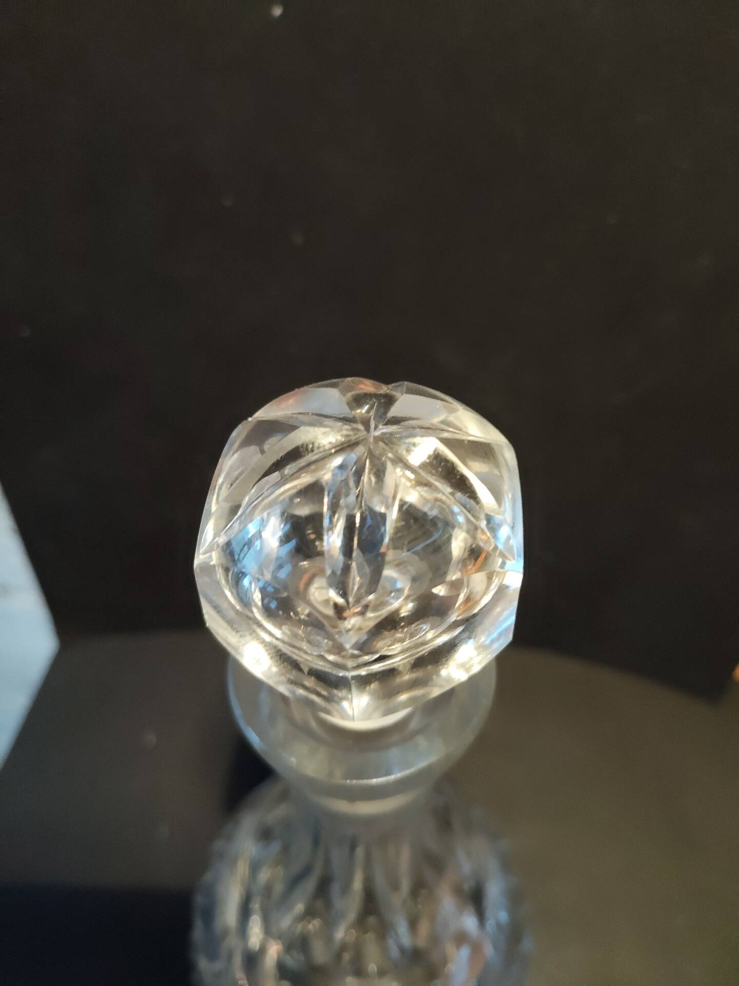 Vintage cut crystal carafe with floral stopper.