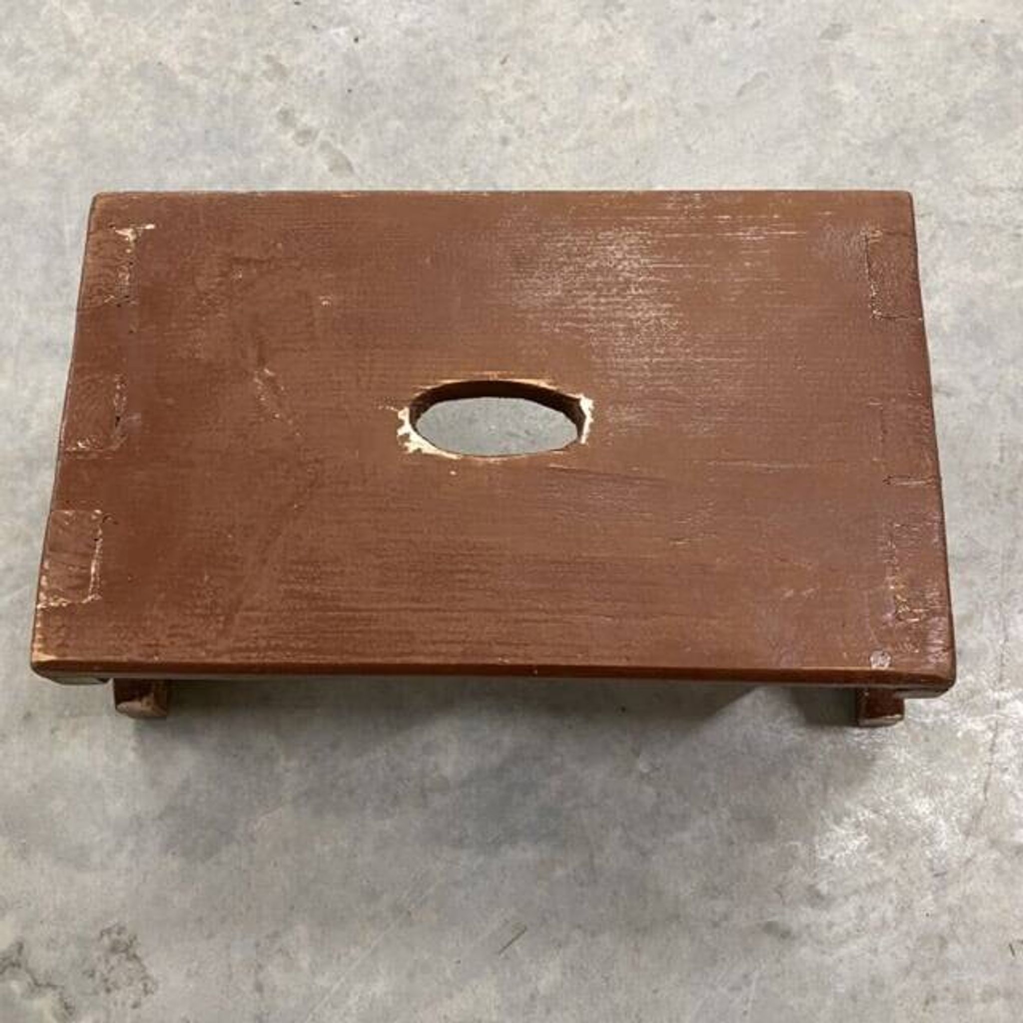 Small stool or Hungarian bench in wine red.