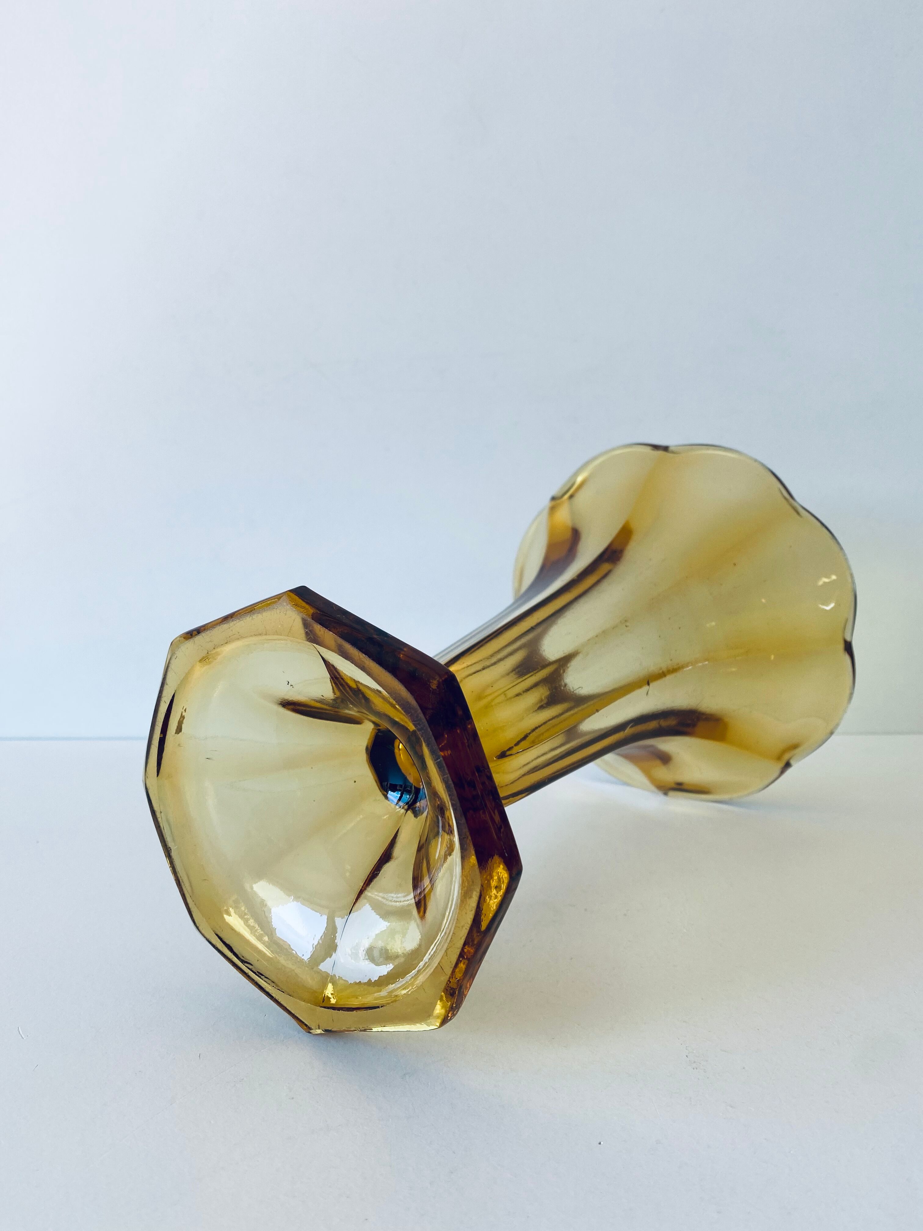 Ancient tulip vase in amber glass