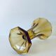 Ancient tulip vase in amber glass