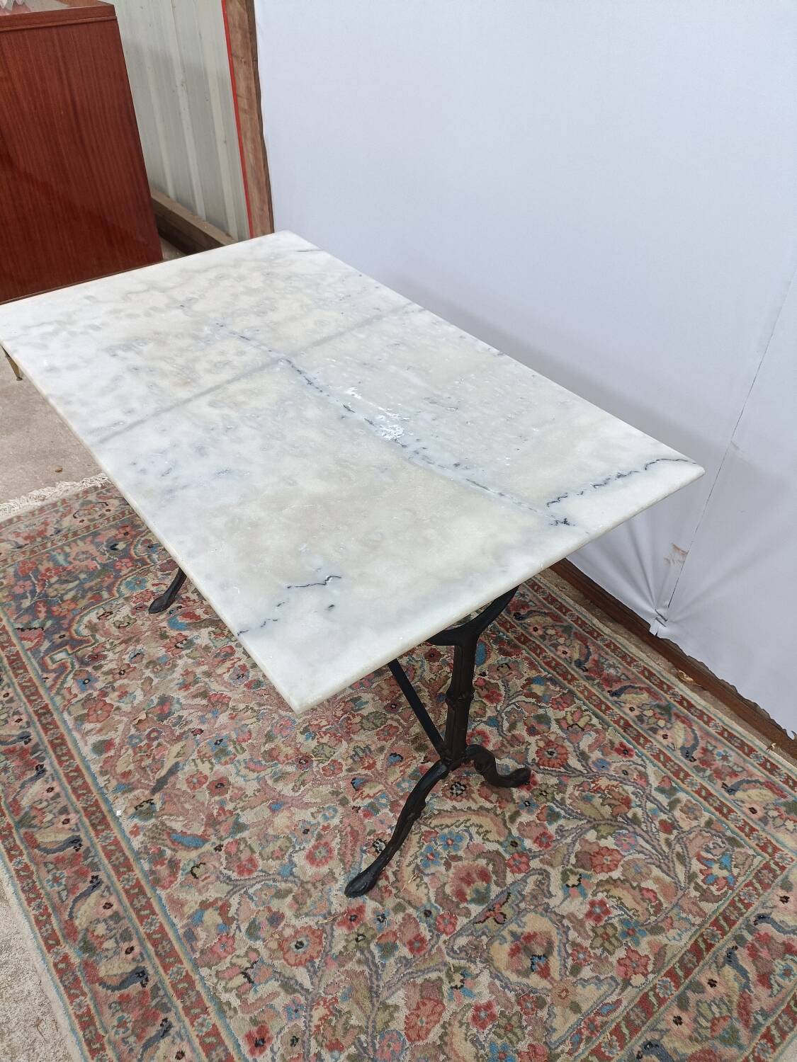 Bistro table with cast iron legs and marble top