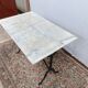Bistro table with cast iron legs and marble top