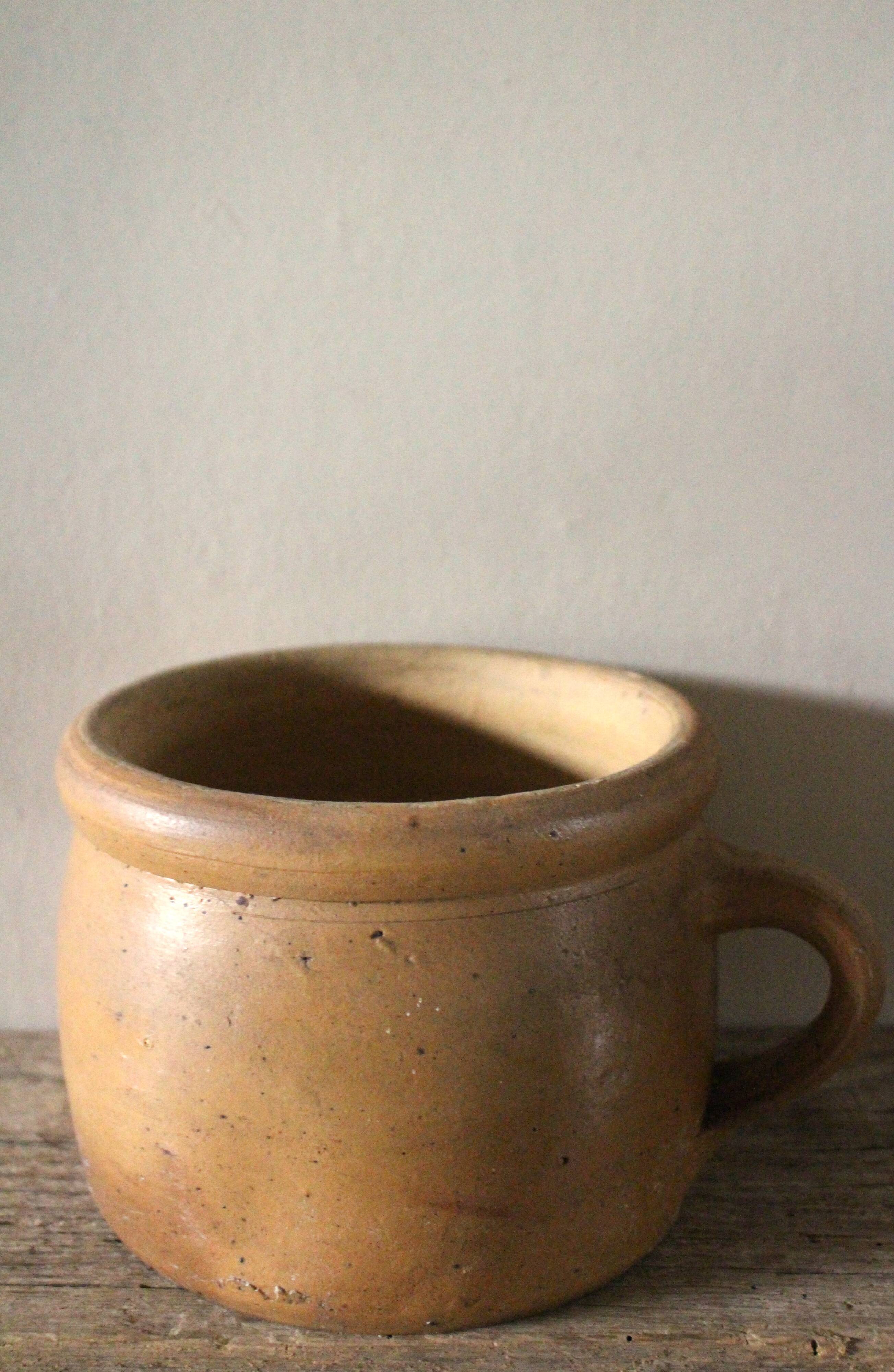 Round terracotta milk jug with handle