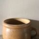 Round terracotta milk jug with handle