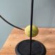 Old painted sheet metal pendulum toy