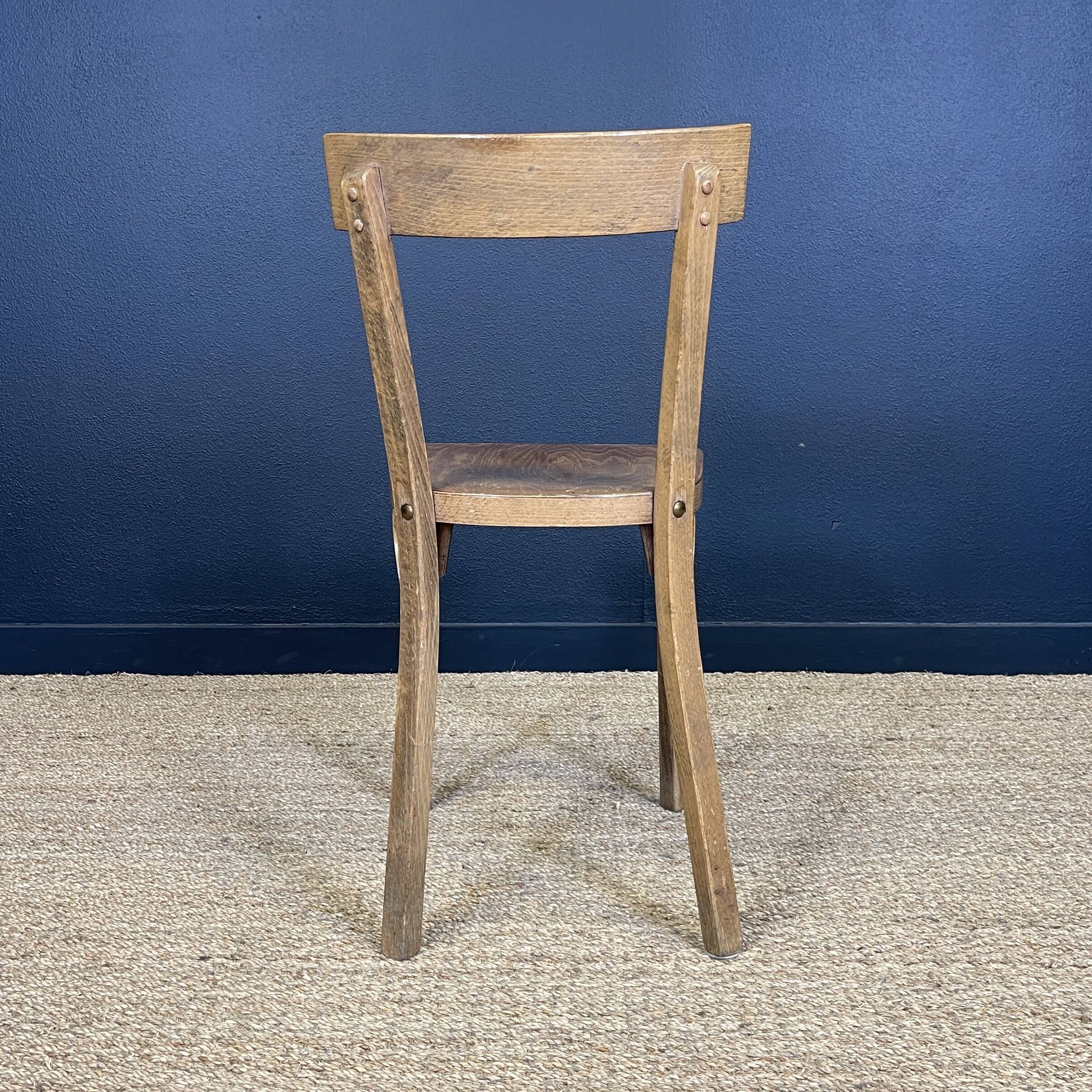 Set of 26 Baumann wooden bistro chairs from the 1950s France