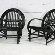 Pair of black lacquered rattan armchairs. France, cira 1960.