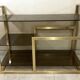 Console / étagère vintage en laiton doré et verre fumé des années 50