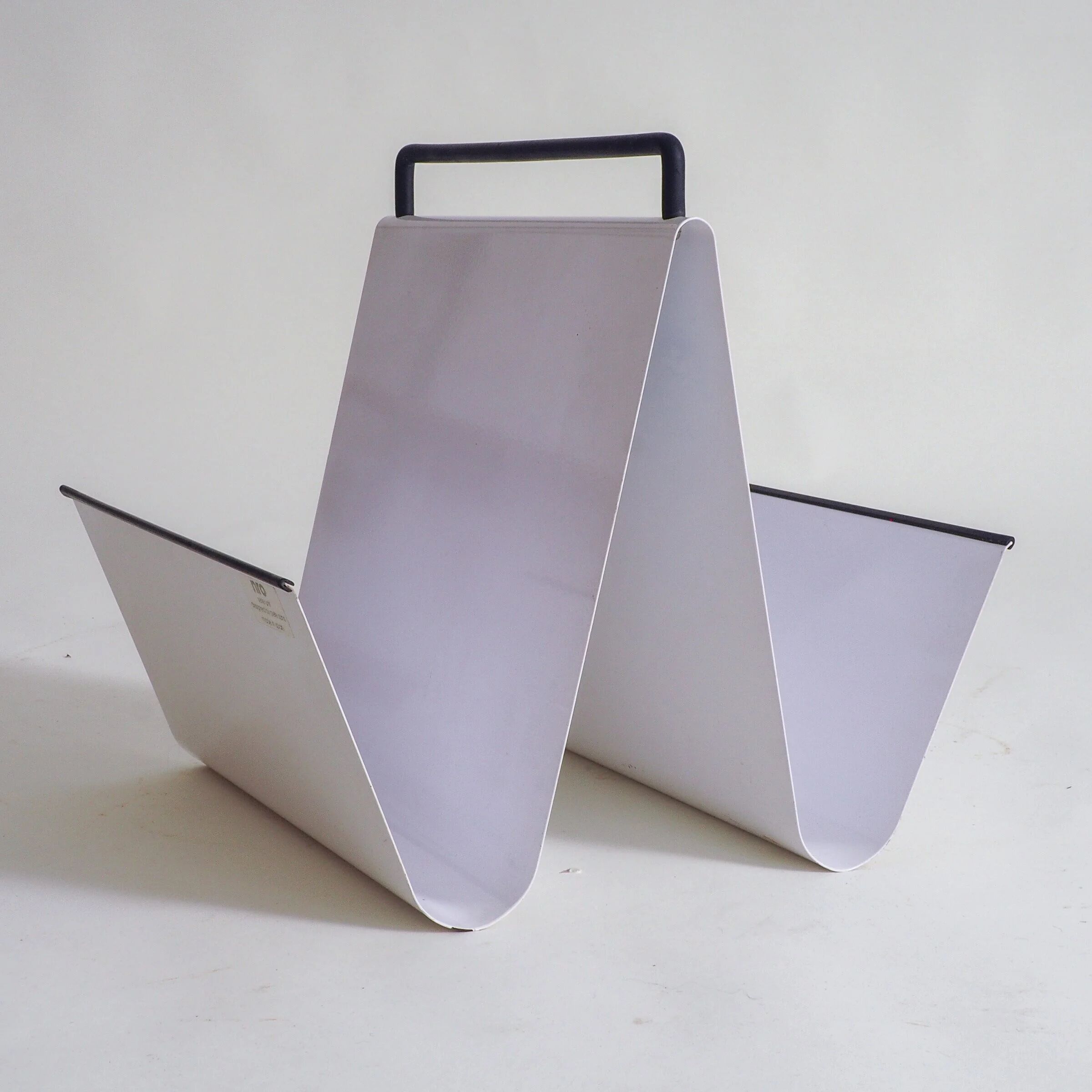Metal magazine holder by Pete Sans for NRO