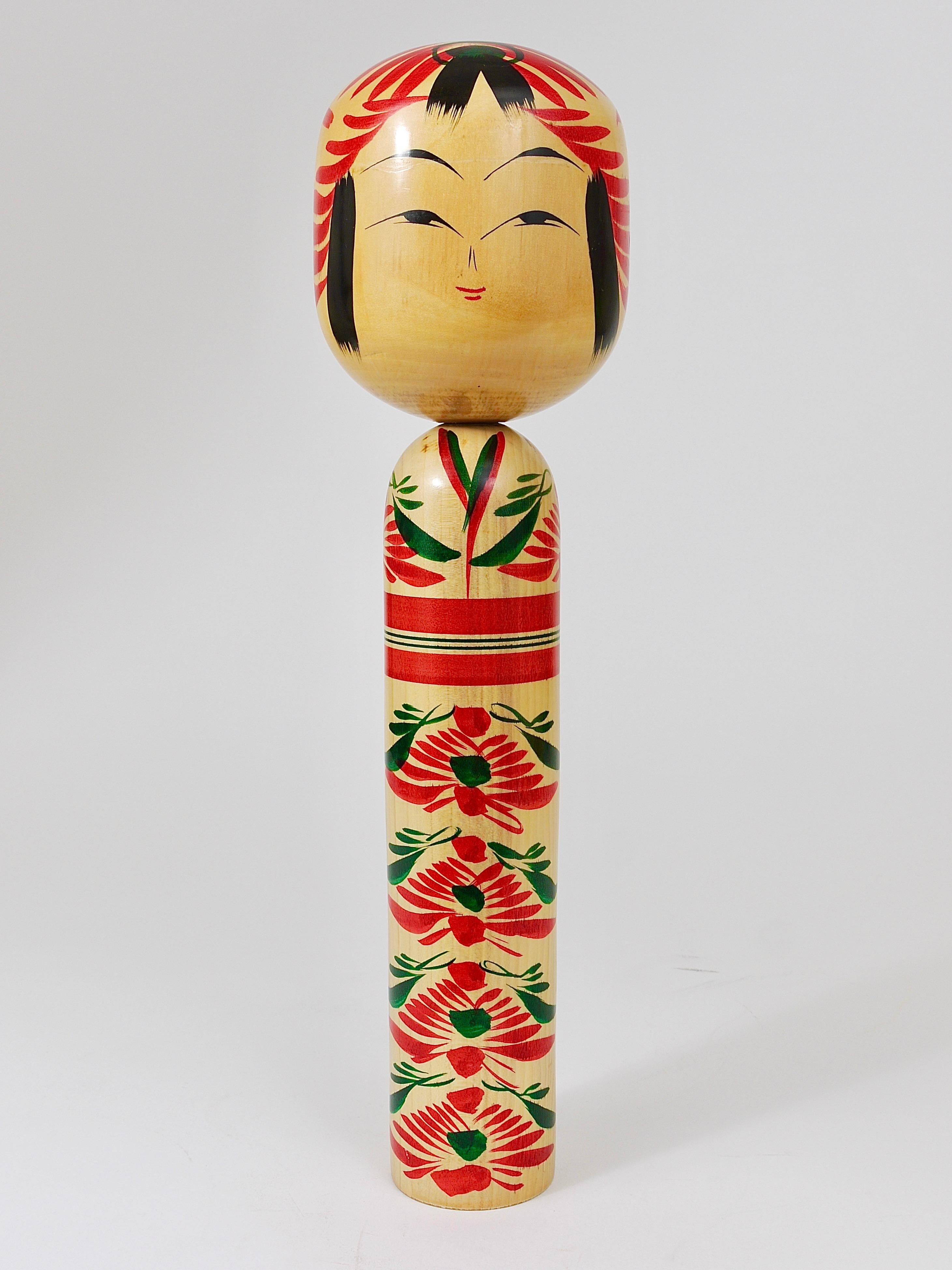 Decorative Kokeshi doll sculpture from northern Japan, hand-painted, signed.