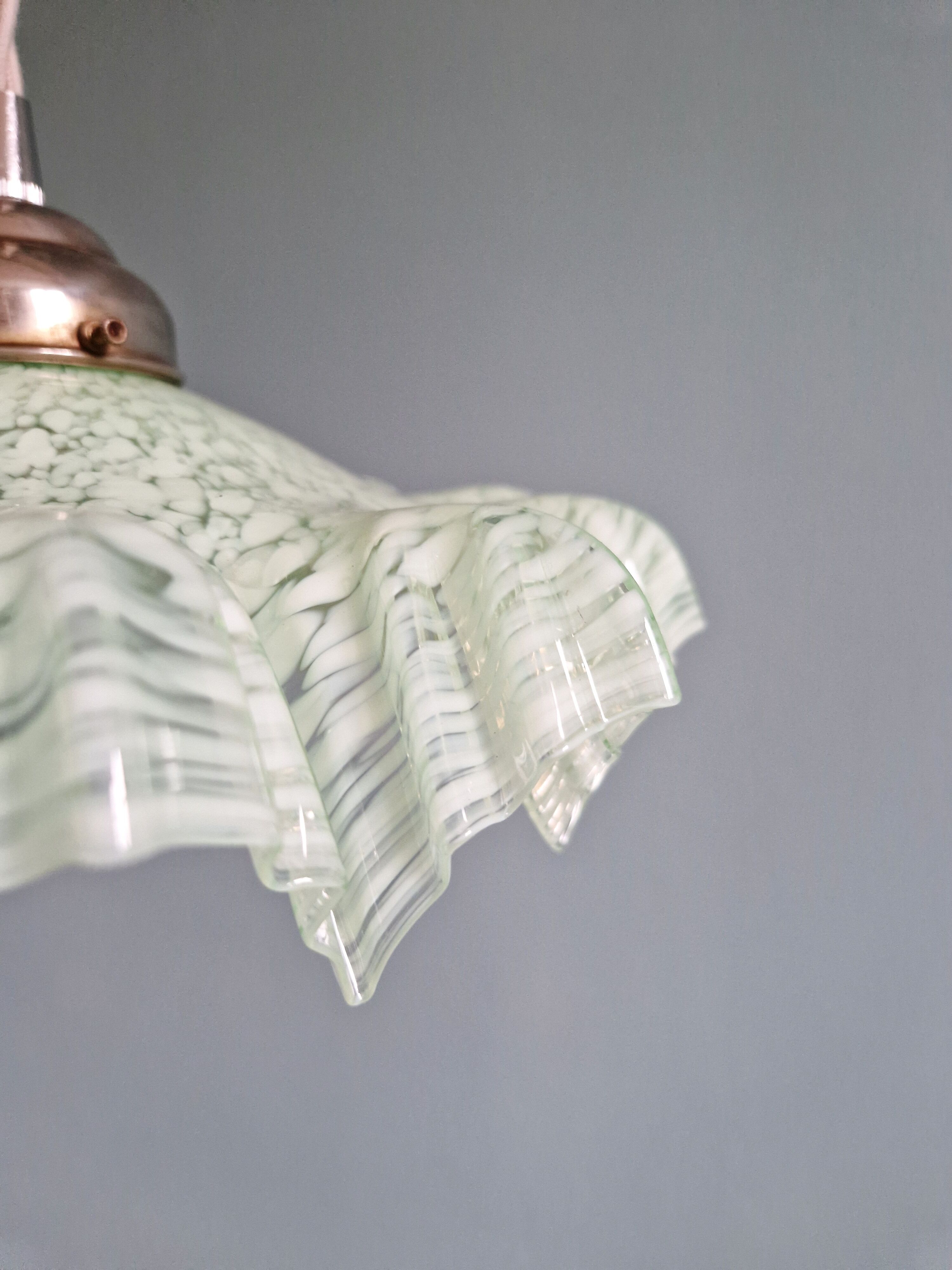 Art Deco pendant light in speckled green and white pleated glass, 1920s-30s.