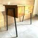 Vintage 1950s sewing machine with blonde oak veneer.