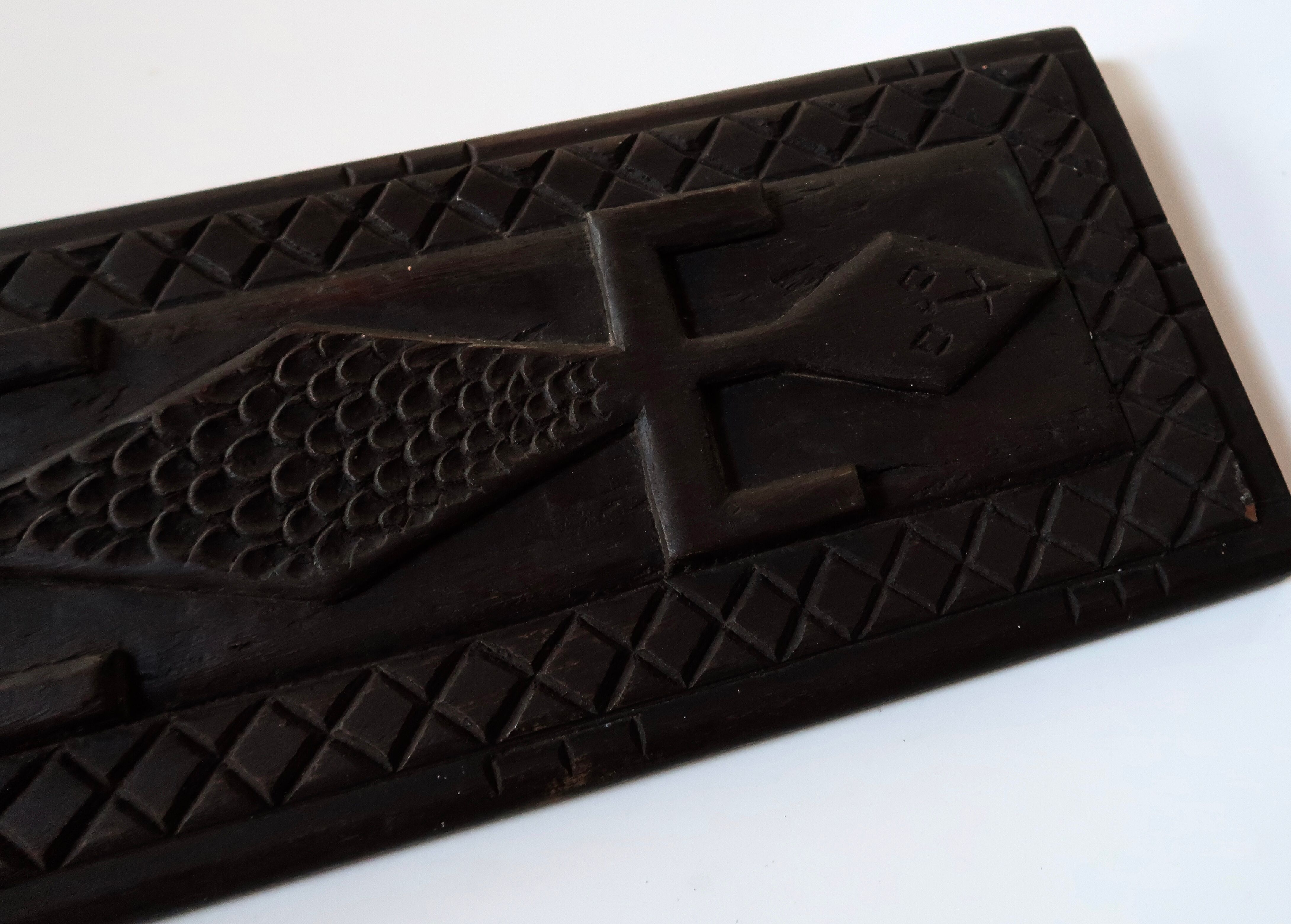 Carved African wall plate, door top