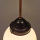 Small Art Deco hanging lamp in cream coloured glass and bakelite top.