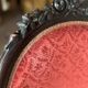 Napoleon III medallion armchair in carved wood and red velvet.