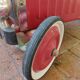 Old pedal car in tole fire truck