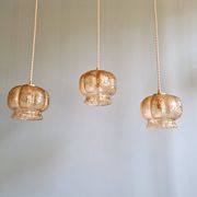 Vintage trio of amber glass pendants, 1960s-70s.