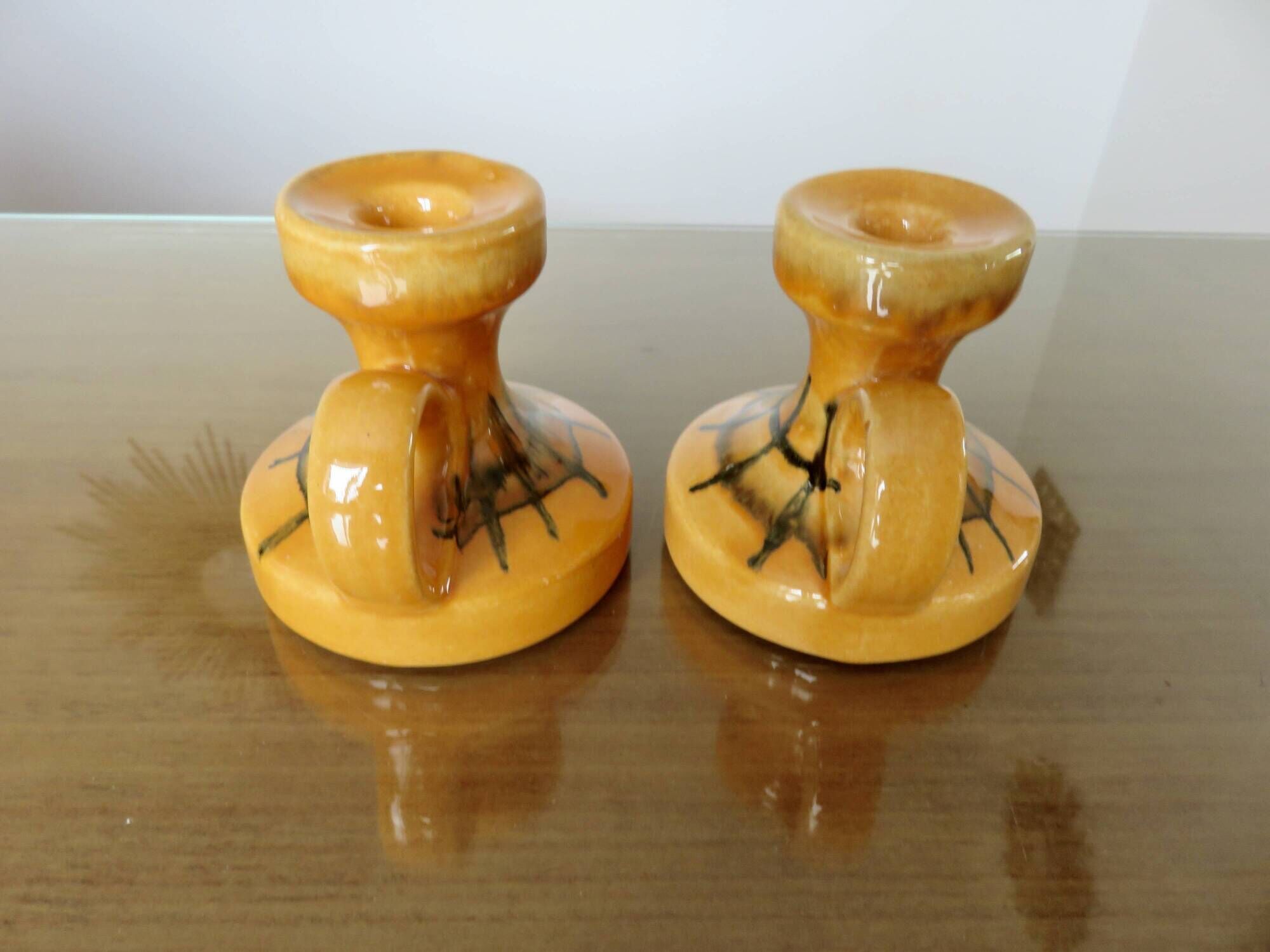 Pair of orange ceramic candlesticks from the 60s