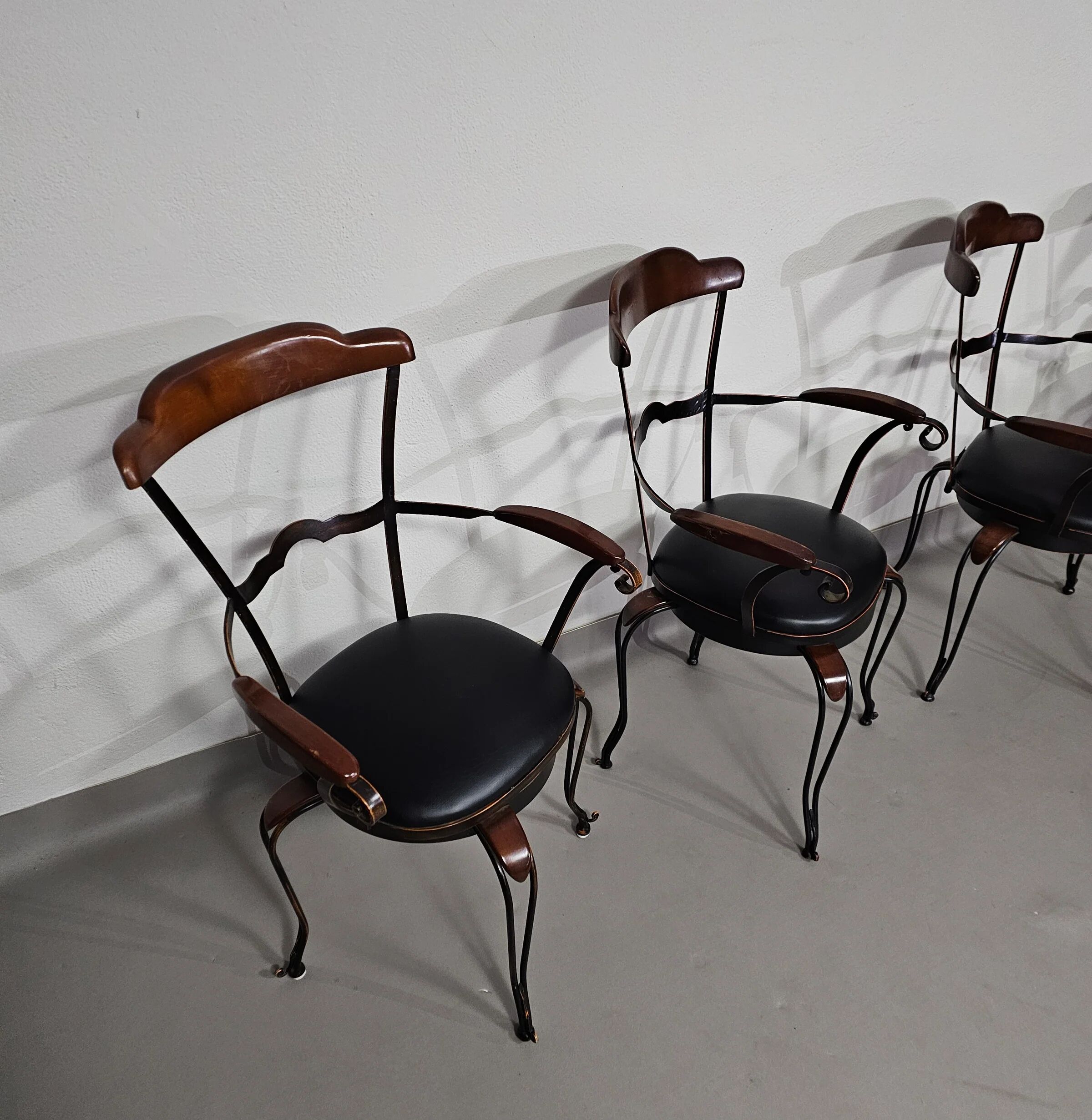 Italian postmodern turnable wrought iron dining chairs with leather seats