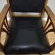 Fauteuil colonial en teck et cuir noir