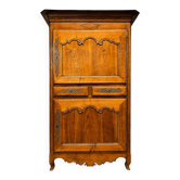 Cherry wood bonnetière from the Louis XV period.